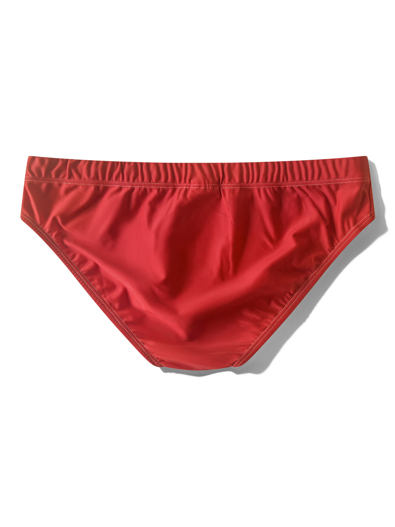 Back side of red swimwear by Bas Bains on white background
