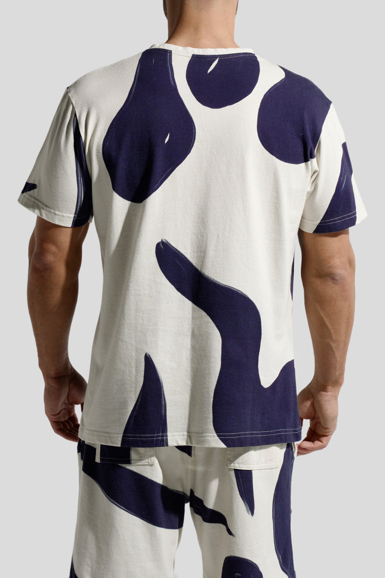 image of organic cotton T-shirt in Rivage print back view on male model by Bas Bains