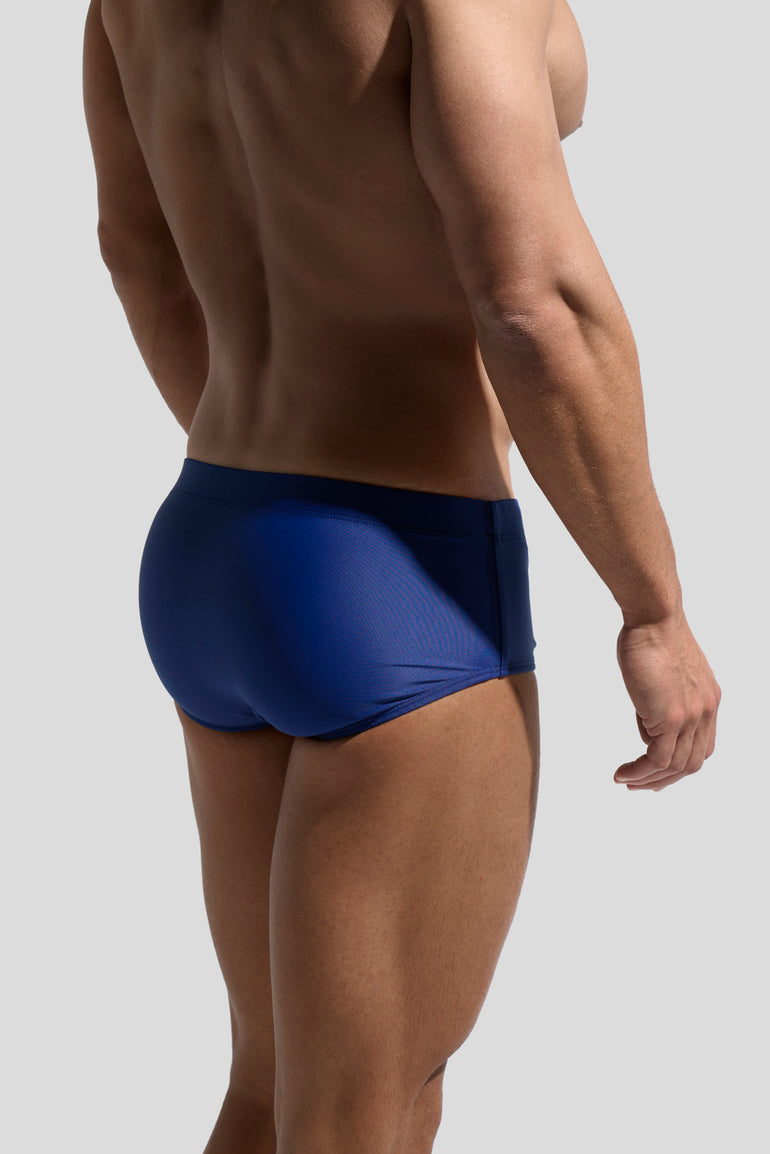 image of swimwear sunga in Marino blue back view on male model by Bas Bains
